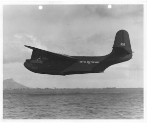 Black and white photograph of plane in flight