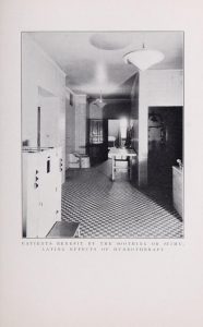 Black and white photograph of hospital corridor