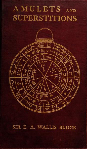 Cover of 'Amulets and superstitions' with an elaborate medallion design including various occult symbols